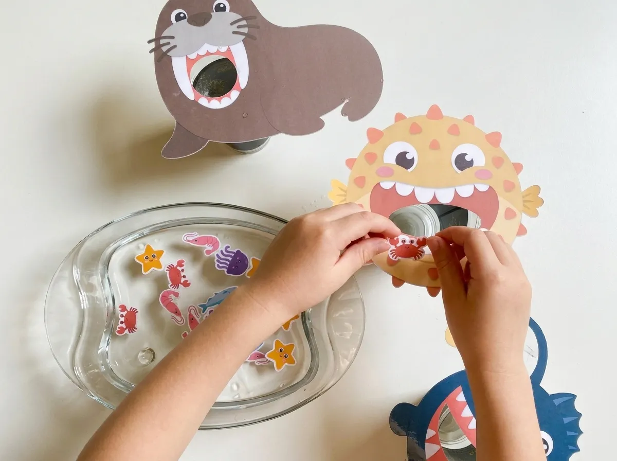Child feeding sea animal