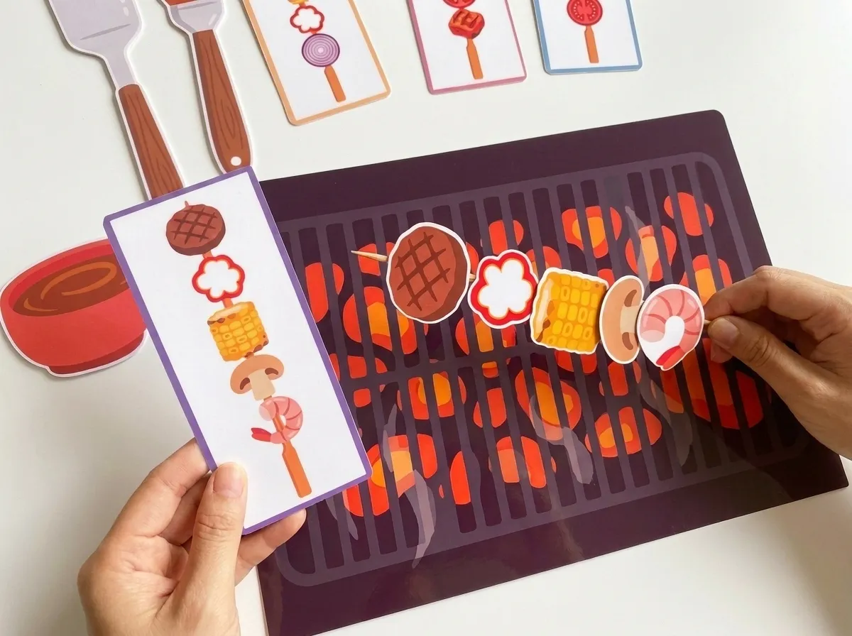 hands assembling bbq food based on card