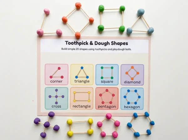 Child building a triangle with playdough balls and toothpicks on the Clay Dough Shapes 2D geometry activity mat